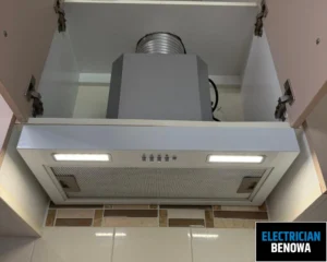 A ceiling-mounted ventilation system with a white exhaust fan