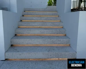 A set of outdoor stairs with concrete steps and wooden accents