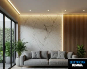 A modern living room with a sofa, chairs, and soft lighting
